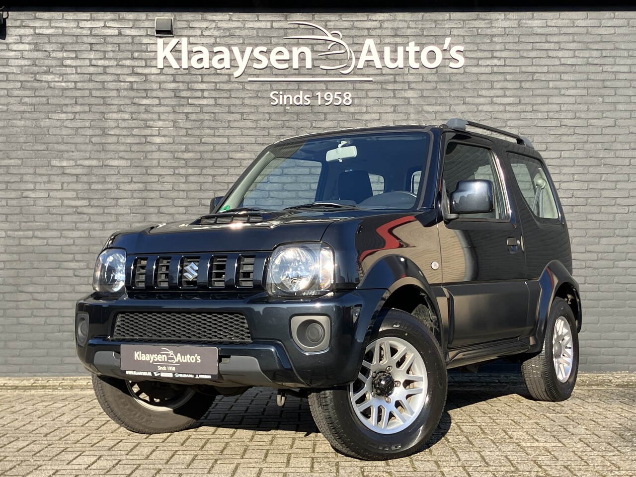Suzuki Jimny - 1.3 Exclusive 4WD AUT. | dealer onderhouden | airco | bluetooth | stoelverwarming | incl. - AutoWereld.nl