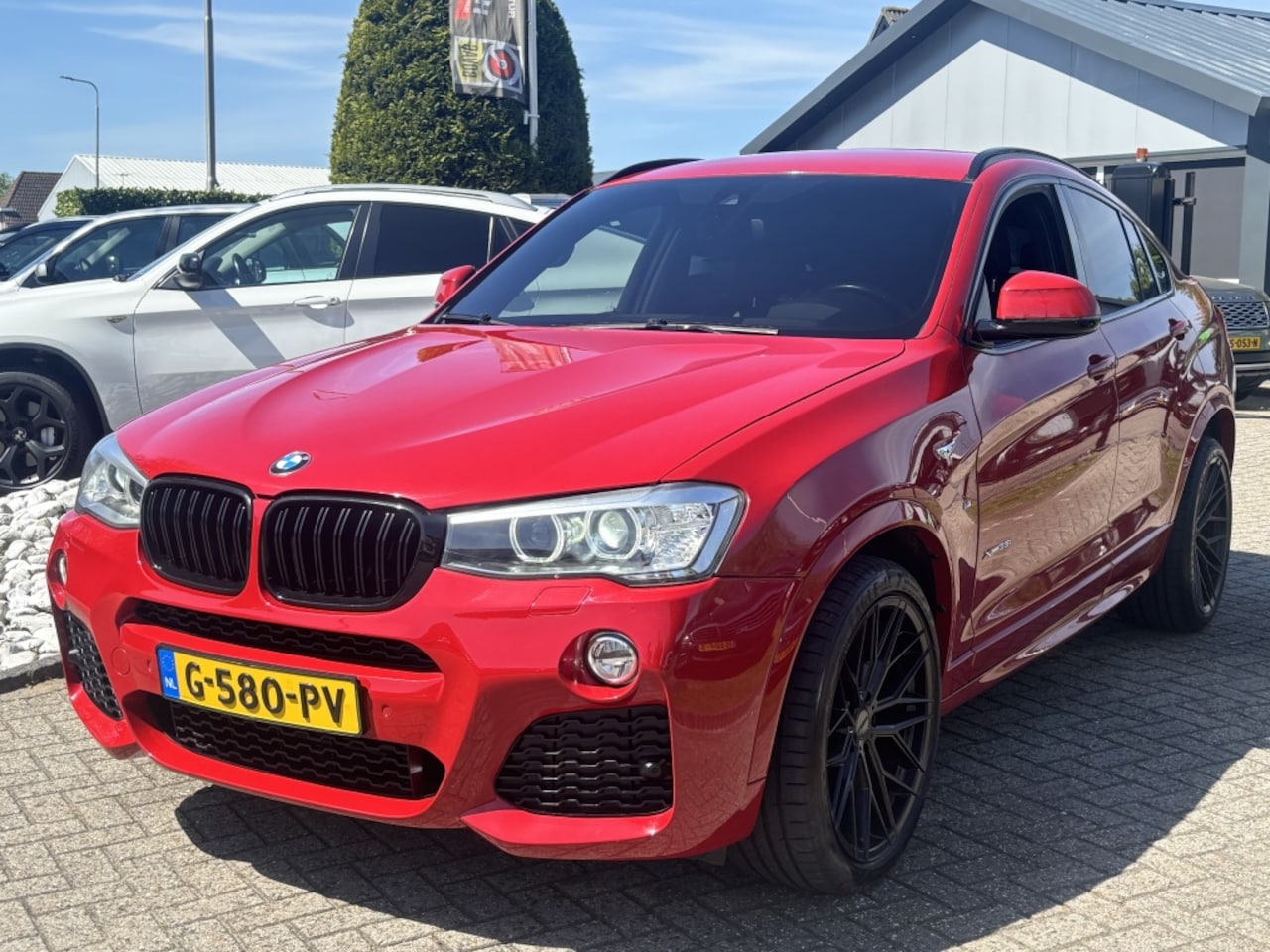BMW X4 - 3.5I Benzine 6-Cilinder High Exe M-Pakket Rood - AutoWereld.nl