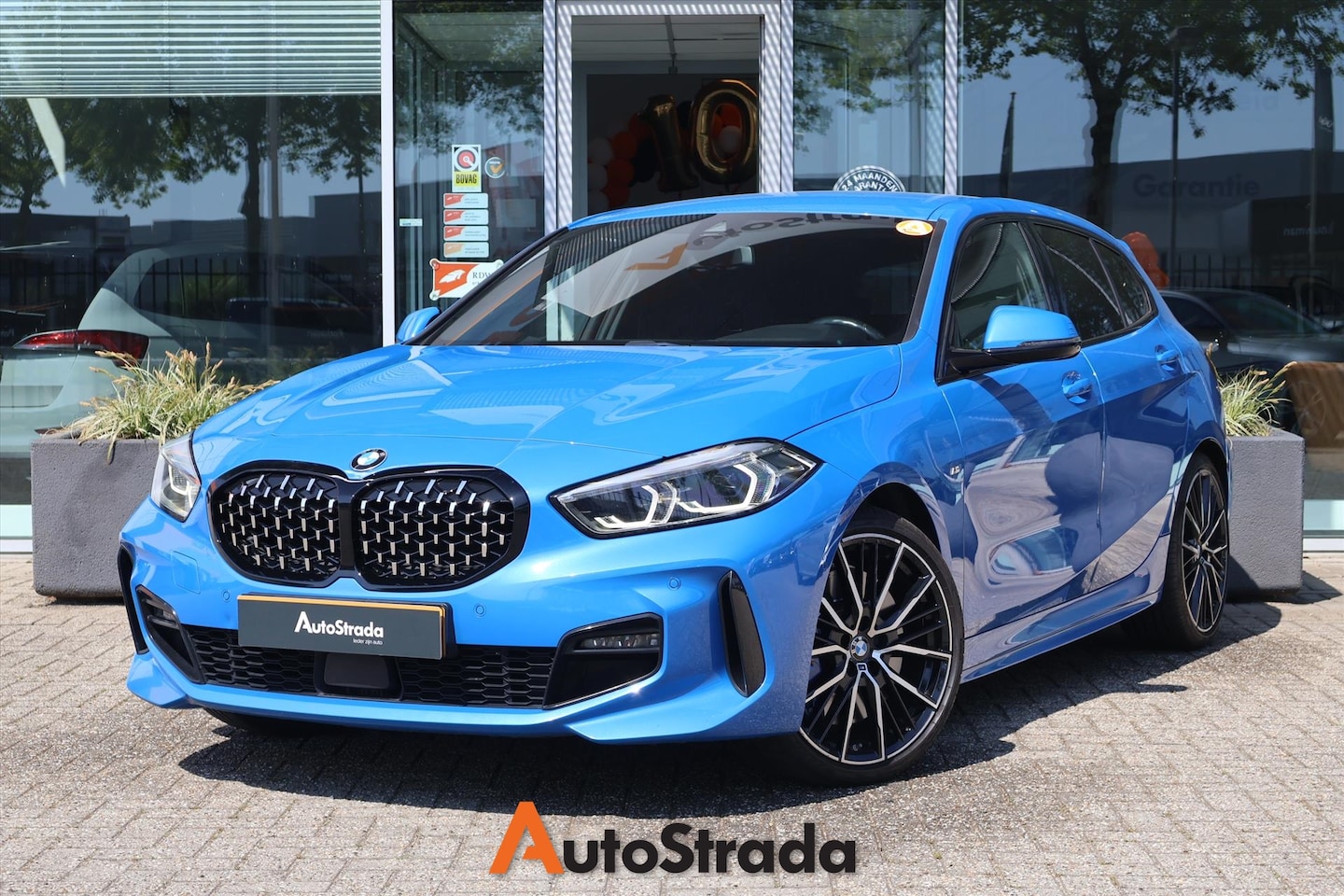 BMW 1-serie - (f40) 118i M-Sport 140PK AUT | Carplay I Misano Blue I Navi I Camera I Kuipstoel - AutoWereld.nl