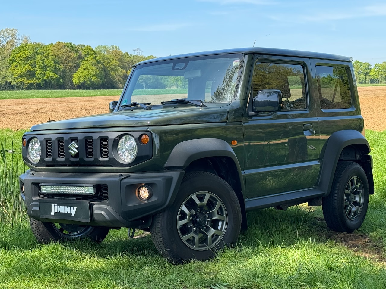 Suzuki Jimny - 1.5 Stijl Allgrip 4x4 / Trekhaak / Navigatie - AutoWereld.nl