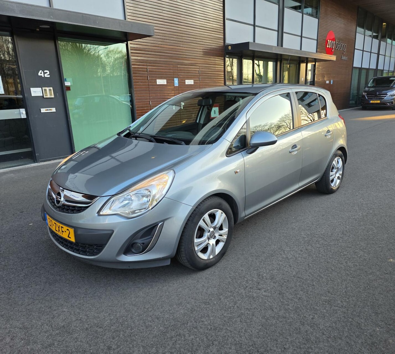 Opel Corsa - 1.2-16V FACELIFT 2013 5drs Airco/NAVI/PDC/APK - AutoWereld.nl