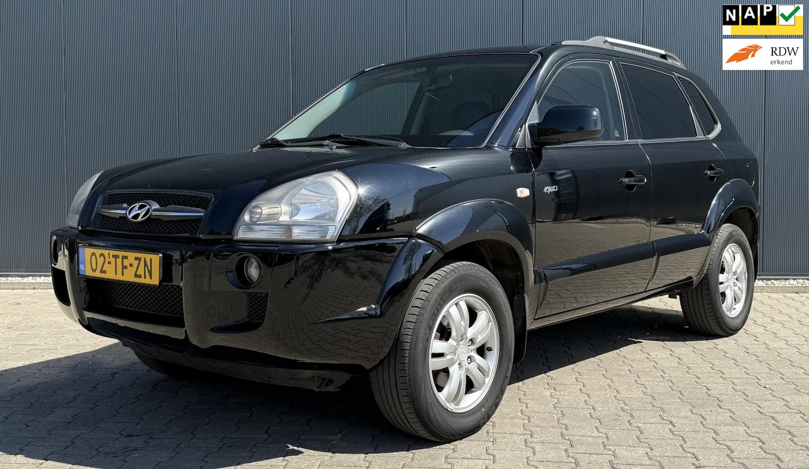 Hyundai Tucson - 2.7i V6 4WD Style Airco cruise Leder Trekhaak Automaat - AutoWereld.nl