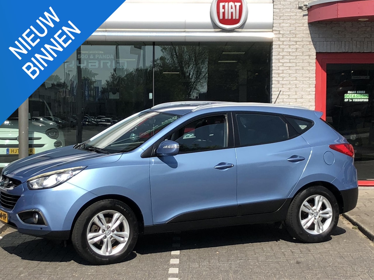 Hyundai ix35 - 2.0i Business Edition AUTOMAAT|AIRCO|NAVI|CAMERA|PDC|17" - AutoWereld.nl