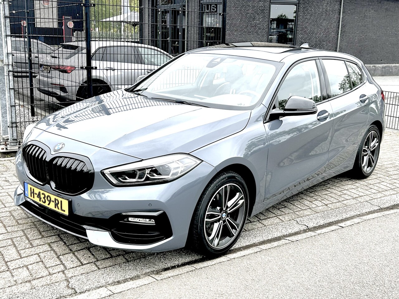 BMW 1-serie - 118i Exe Edition Panoramadak Sport leder - AutoWereld.nl