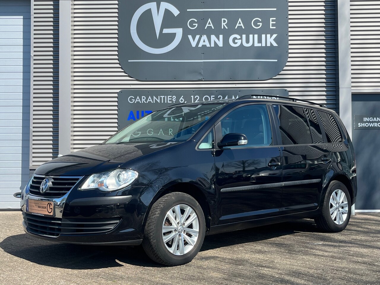 Volkswagen Touran - 1.6 102PK Comfortline Business 7pers Clima,Cruise,Trekhaak,Pdc,Navi,Isofix,Stuurb.,GetintG - AutoWereld.nl