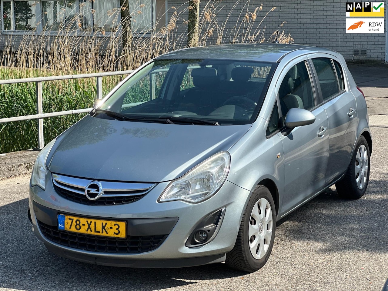 Opel Corsa - 1.4-16V Anniversary Edition!2012!5-deurs!navi!Airco! - AutoWereld.nl