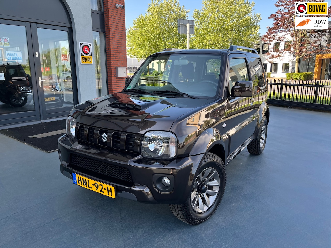 Suzuki Jimny - 1.3 Exclusive LEDER STOELVERWARMING AIRCO LMV - AutoWereld.nl