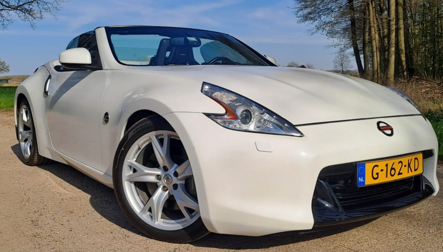 Nissan 370Z Roadster - 3.7 V6 338pk 2010 Roadster Automaat Xenon Navi  Uniek Top - AutoWereld.nl