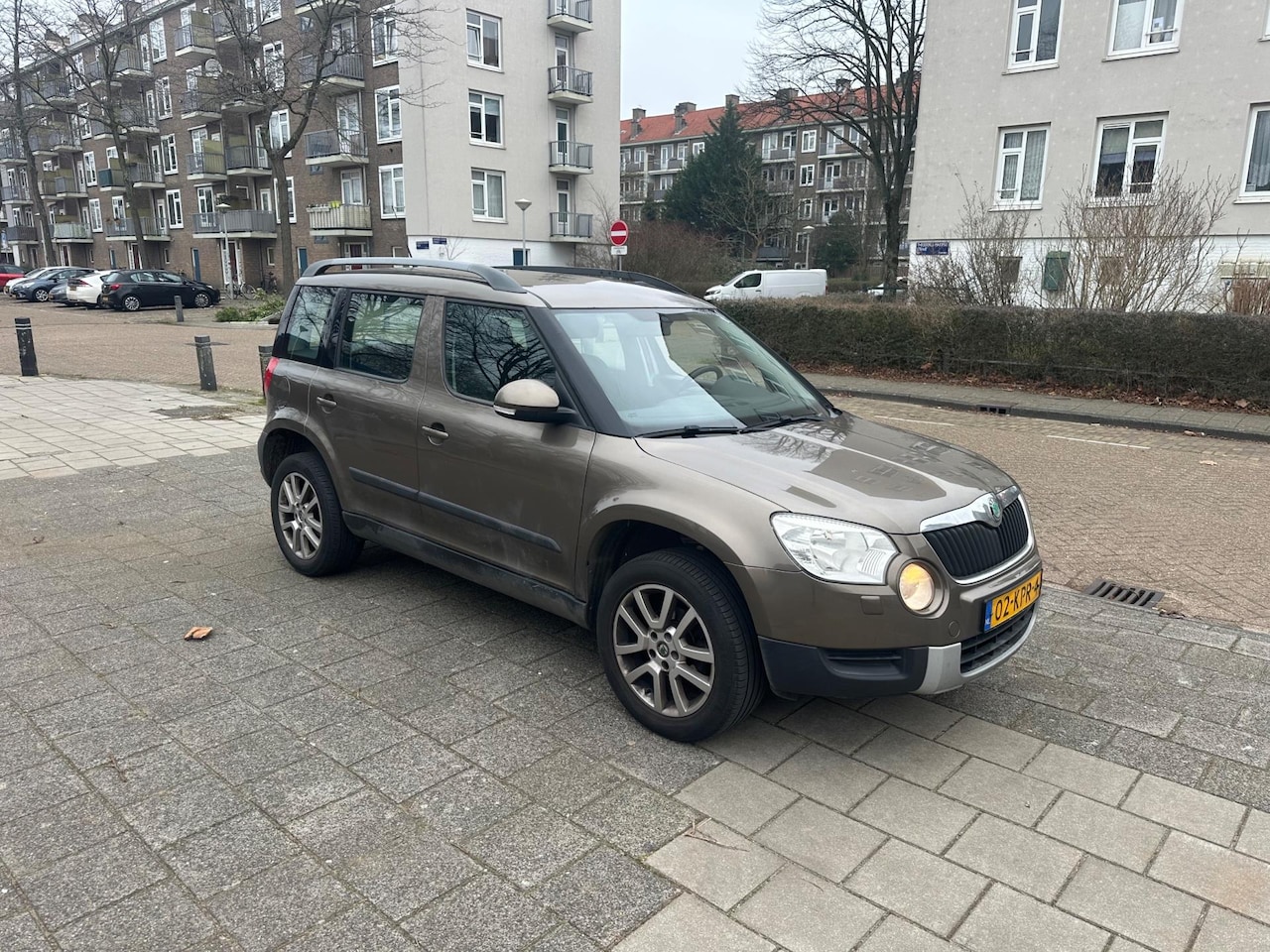 Skoda Yeti - 1.2 TSI Ambition 1-eigenaar Airco Cruise Brown Metallic - AutoWereld.nl