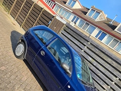 Opel Corsa - 1.2-16V Rhythm