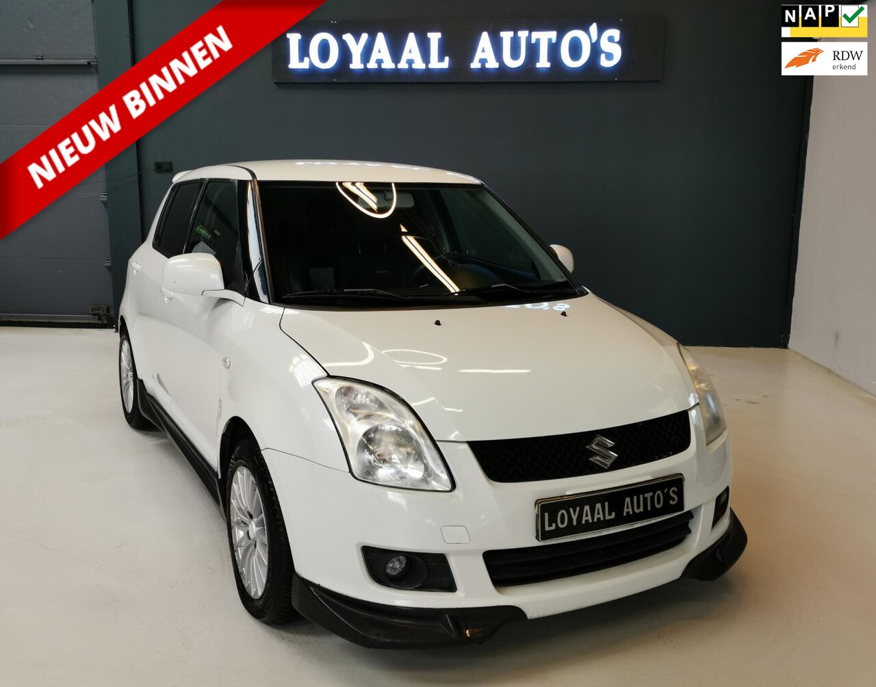 Suzuki Swift - 1.3 Shogun Parelmoer | NAVI | AIRCO | LEDER | NAP | APK. - AutoWereld.nl