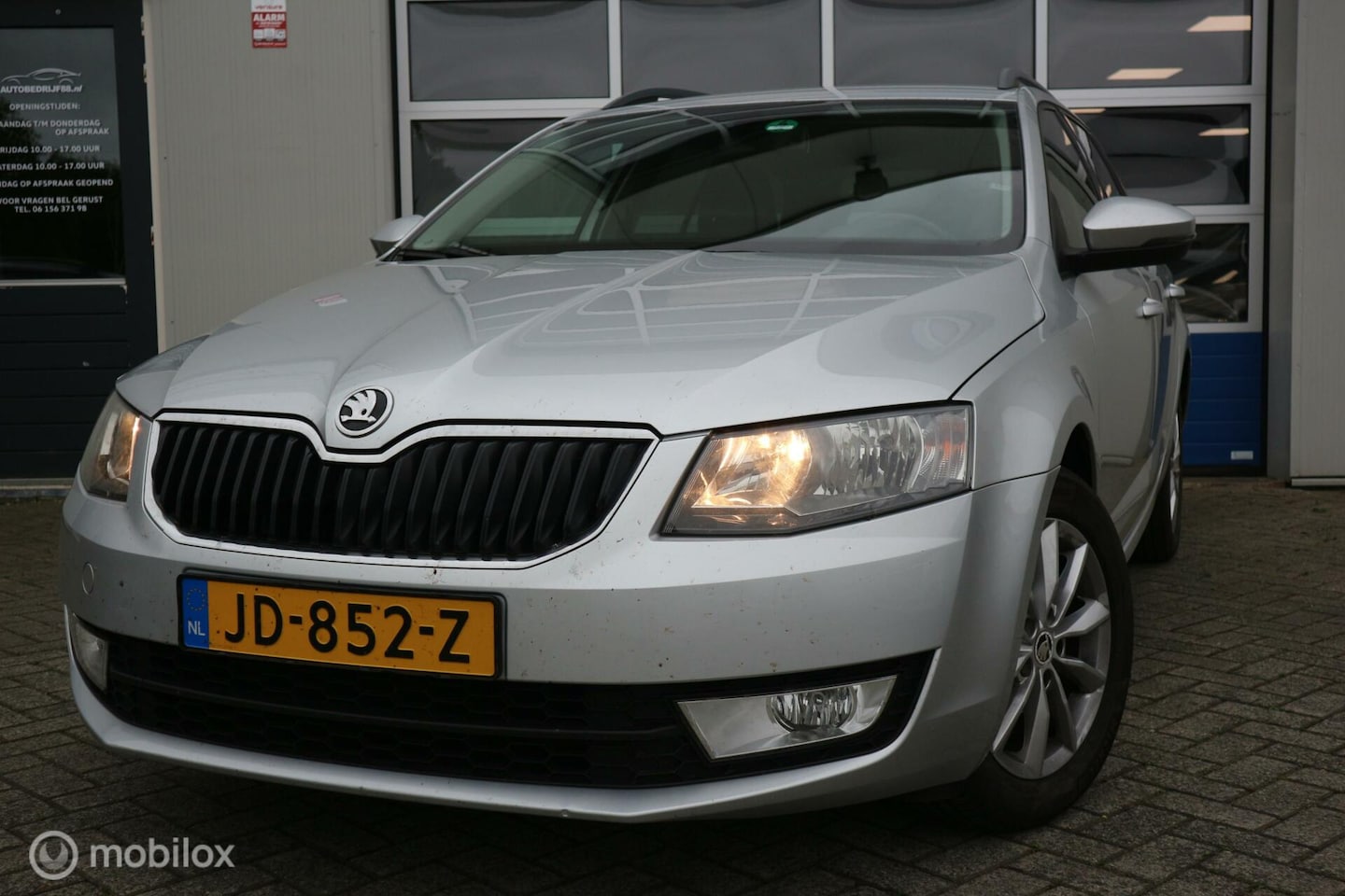 Skoda Octavia Combi - 1.2 TSI Greentech Ambition ECC/NAVI/PDC - AutoWereld.nl