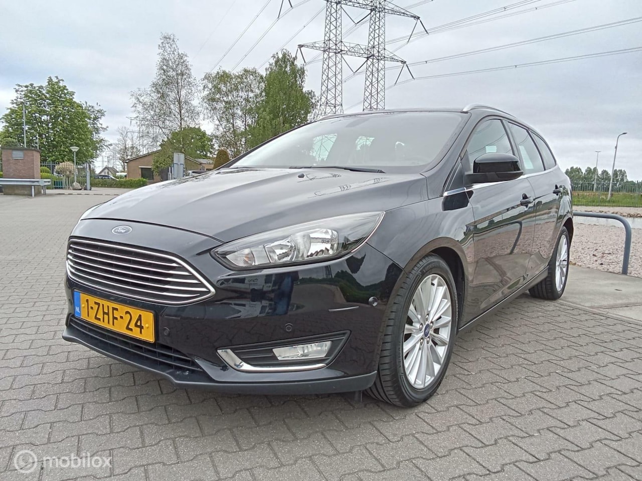 Ford Focus Wagon - 1.0 Titanium Edition/clima/navi/cruise - AutoWereld.nl