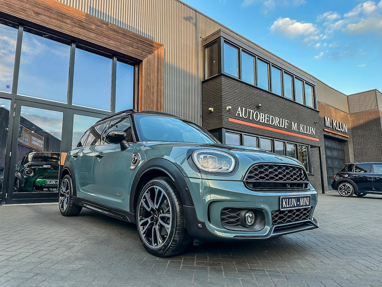 MINI Countryman - Mini 2.0 Cooper S E ALL4 John Cooper Works 220pk/Camera/Leer/Hk/Btw/Bomvol - AutoWereld.nl