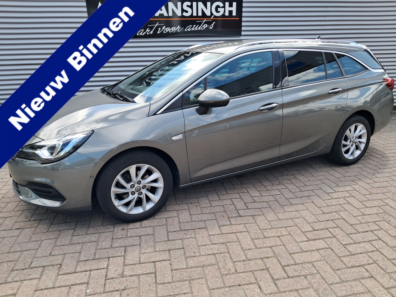 Opel Astra Sports Tourer - 1.2 Elegance!! | Clima | Cruise | LM Velgen | PDC voor en achter | Camera | Keyless | Navi - AutoWereld.nl