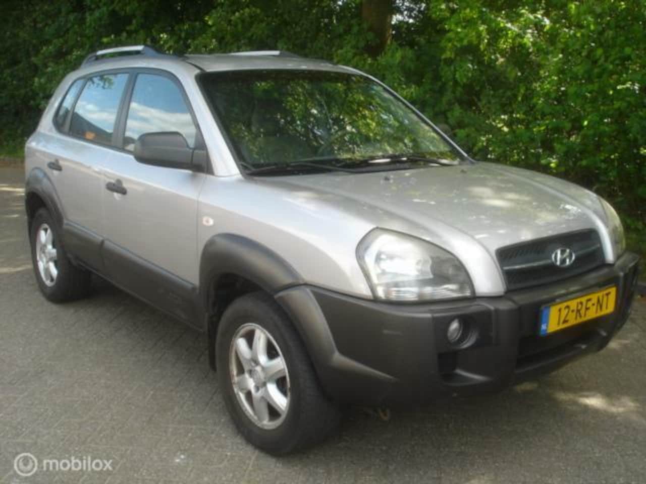 Hyundai Tucson - 2.0 I 16V 104 KW Active Airco APK 5-2026. - AutoWereld.nl
