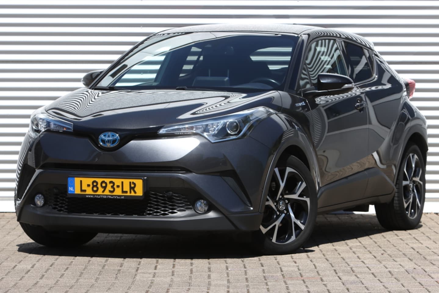 Toyota C-HR - 1.8 Hybrid Executive Bi-Tone JBL / Leer - AutoWereld.nl