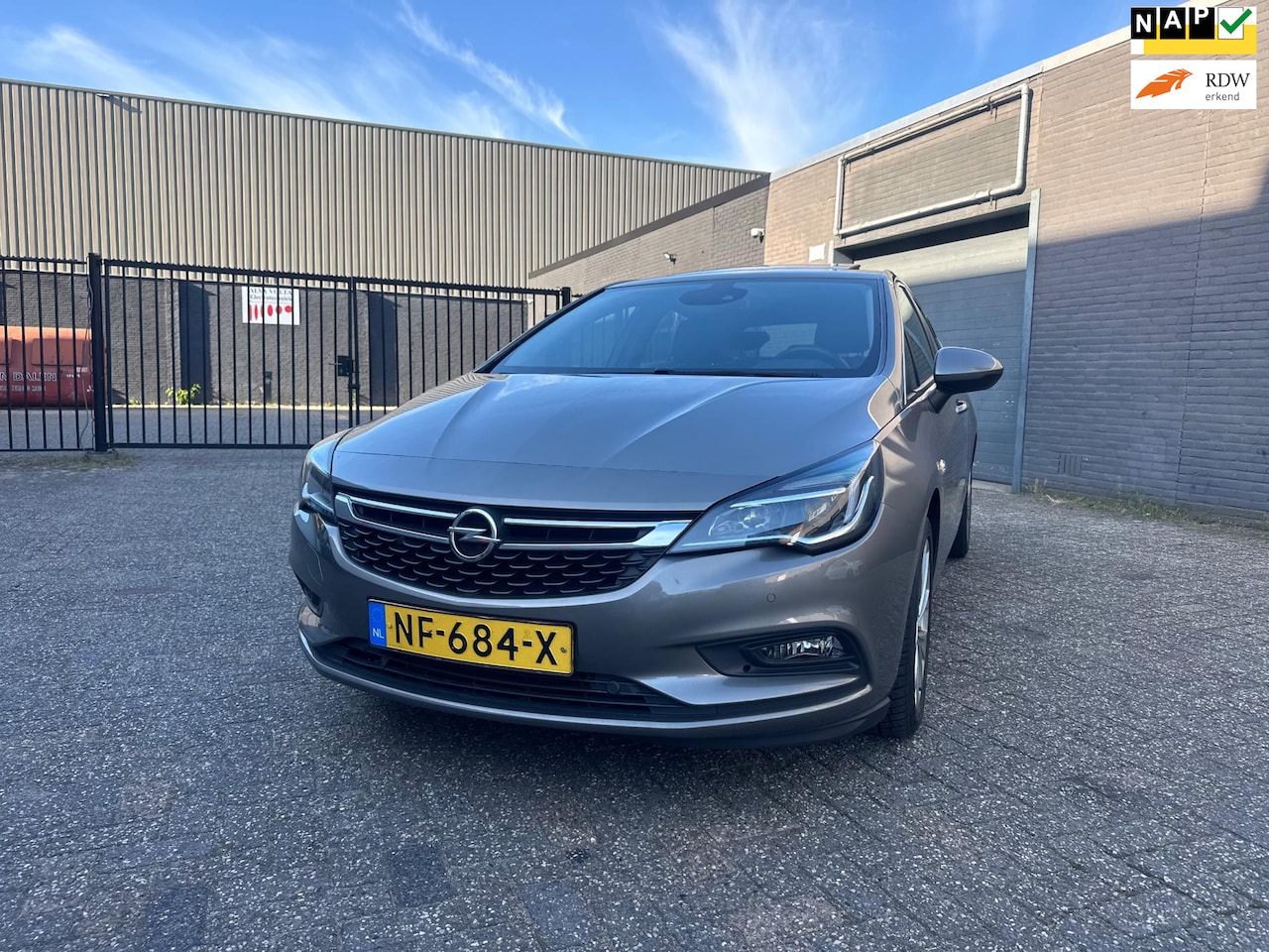 Opel Astra - 1.4 Business+ Aut. Clima Navi Dak PDC Led LM-Wielen APK NAP. - AutoWereld.nl