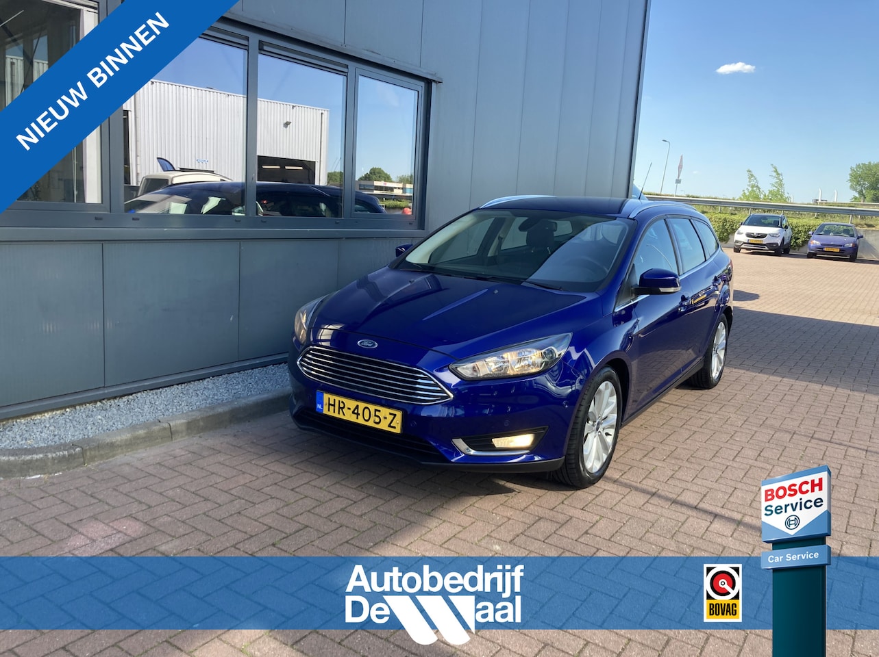 Ford Focus Wagon - 1.0 Ecob. 125pk Titanium Edition NAVI/CLIMA/CRUISE/PDC/TREKH./VOORRUITVERWARMING - AutoWereld.nl