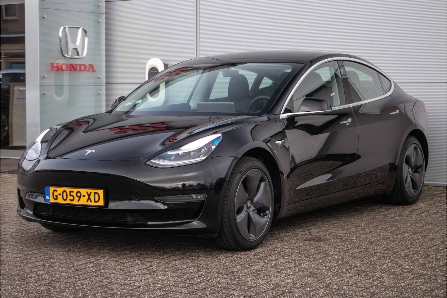 Tesla Model 3 - Long Range RWD Long Range AWD 75 kWh All-in rijklaarprijs | Leder | Nav | Autopilot | Panodak | Cam - AutoWereld.nl