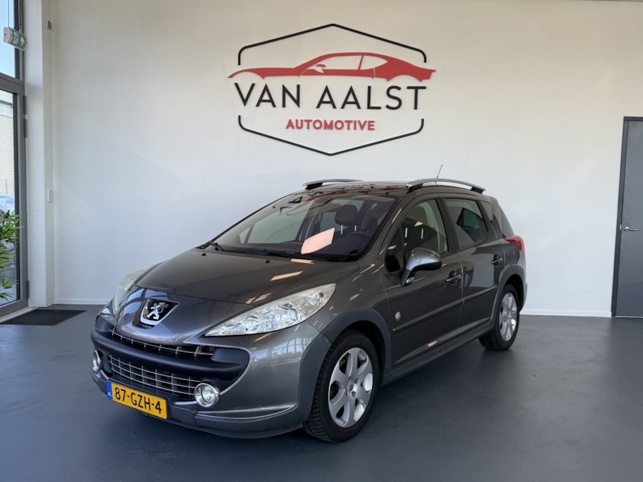 Peugeot 207 SW Outdoor - 1.6 VTi XS Clima/ Pano/ Trakhaak/ Half leder - AutoWereld.nl