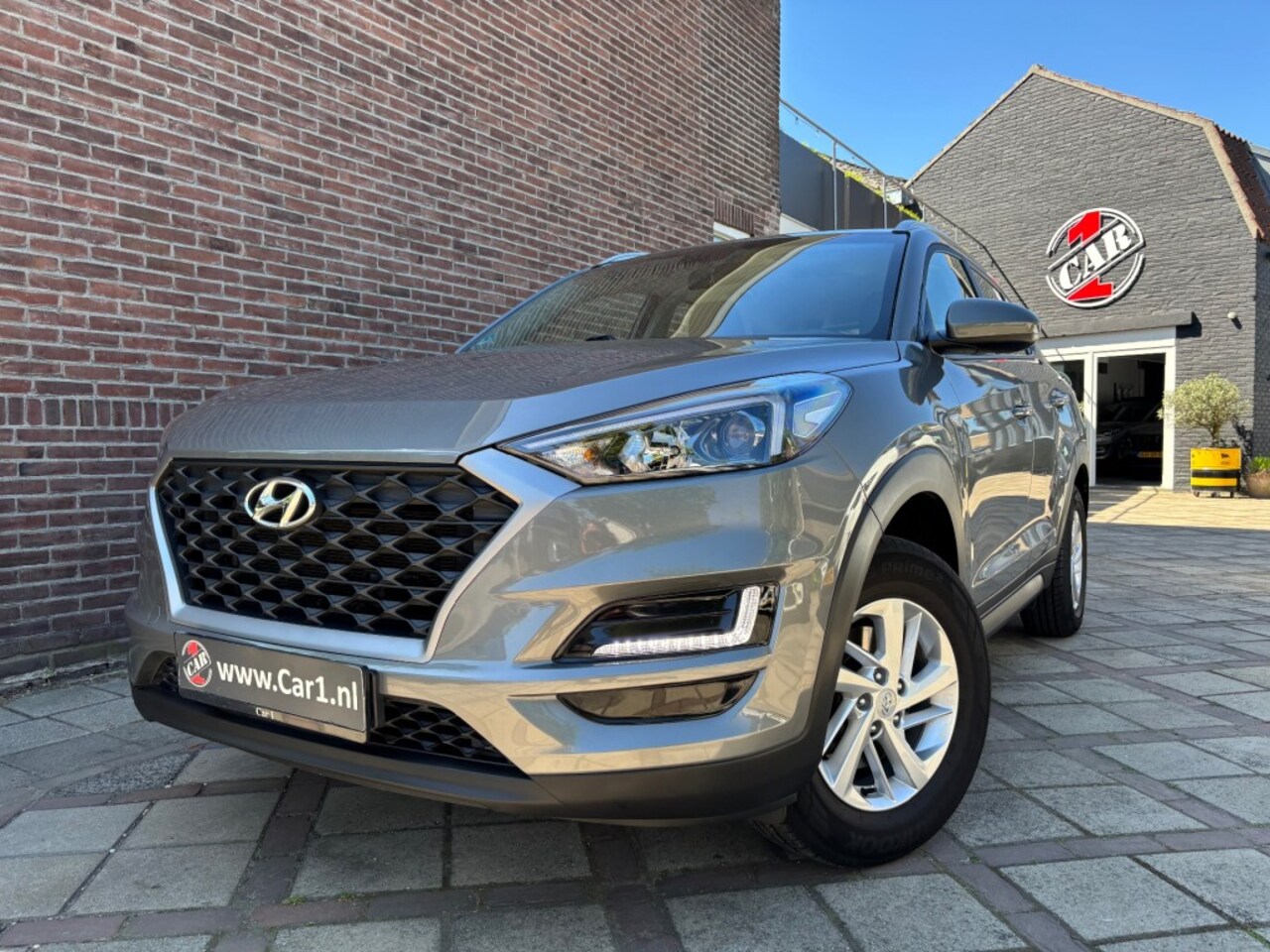 Hyundai Tucson - 1.6 GDI NAVI CAMERA PDC STOELVERW APPLE CAR PLAY - AutoWereld.nl