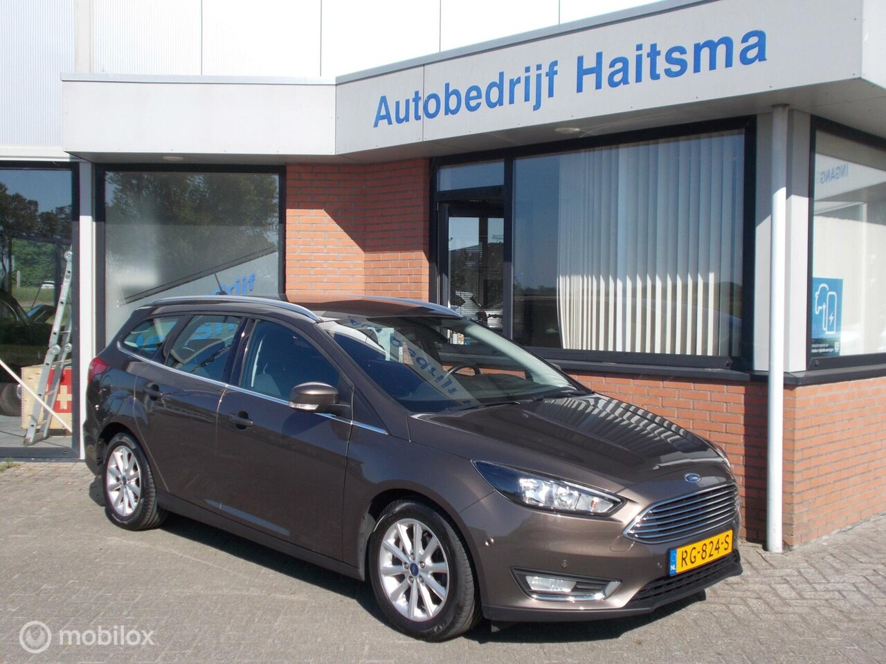 Ford Focus Wagon - 1.0 Titanium Climate | Tr.hk | Navi - AutoWereld.nl