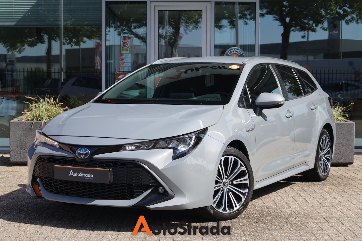 Toyota Corolla Touring Sports - 2.0 Business Plus Hybrid 184pk | Camera | Keyless | Climate | Adaptive | Carplay | LED - AutoWereld.nl