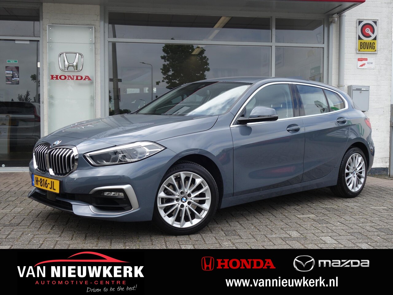 BMW 1-serie - (f40) 118i 140pk Automaat Luxury Line | Leer | Adaptive Cruise Control | Camera - AutoWereld.nl