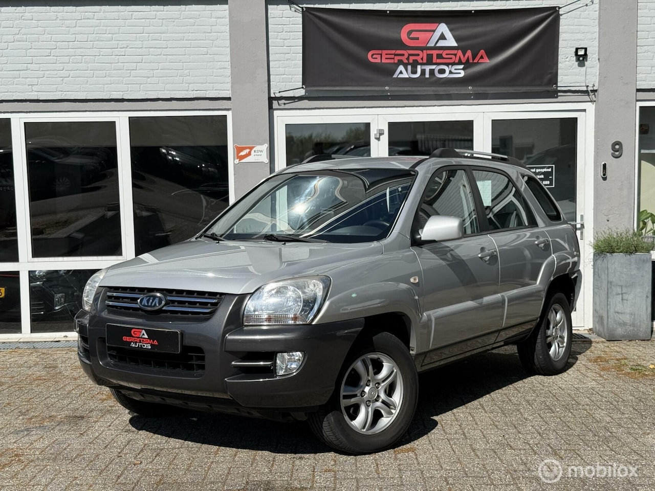 Kia Sportage - 2.0 CVVT Executive 2.0 CVVT Executive - AutoWereld.nl