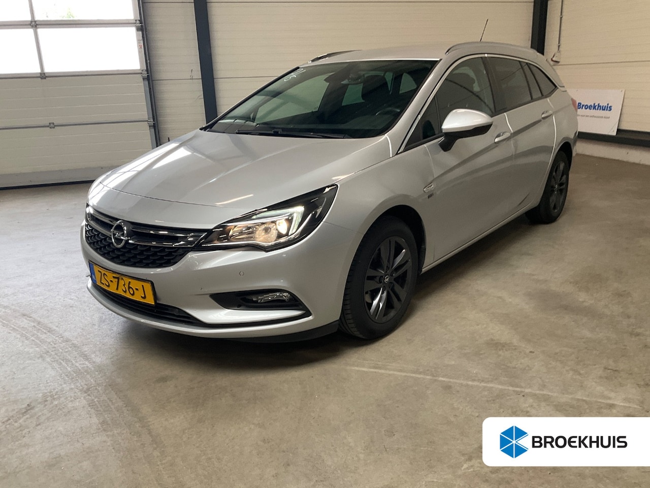 Opel Astra Sports Tourer - 1.0 Turbo 120 Jaar Edition | Navi | Clima | Parkeersensoren V+A | Cruise Control | Lichtme - AutoWereld.nl