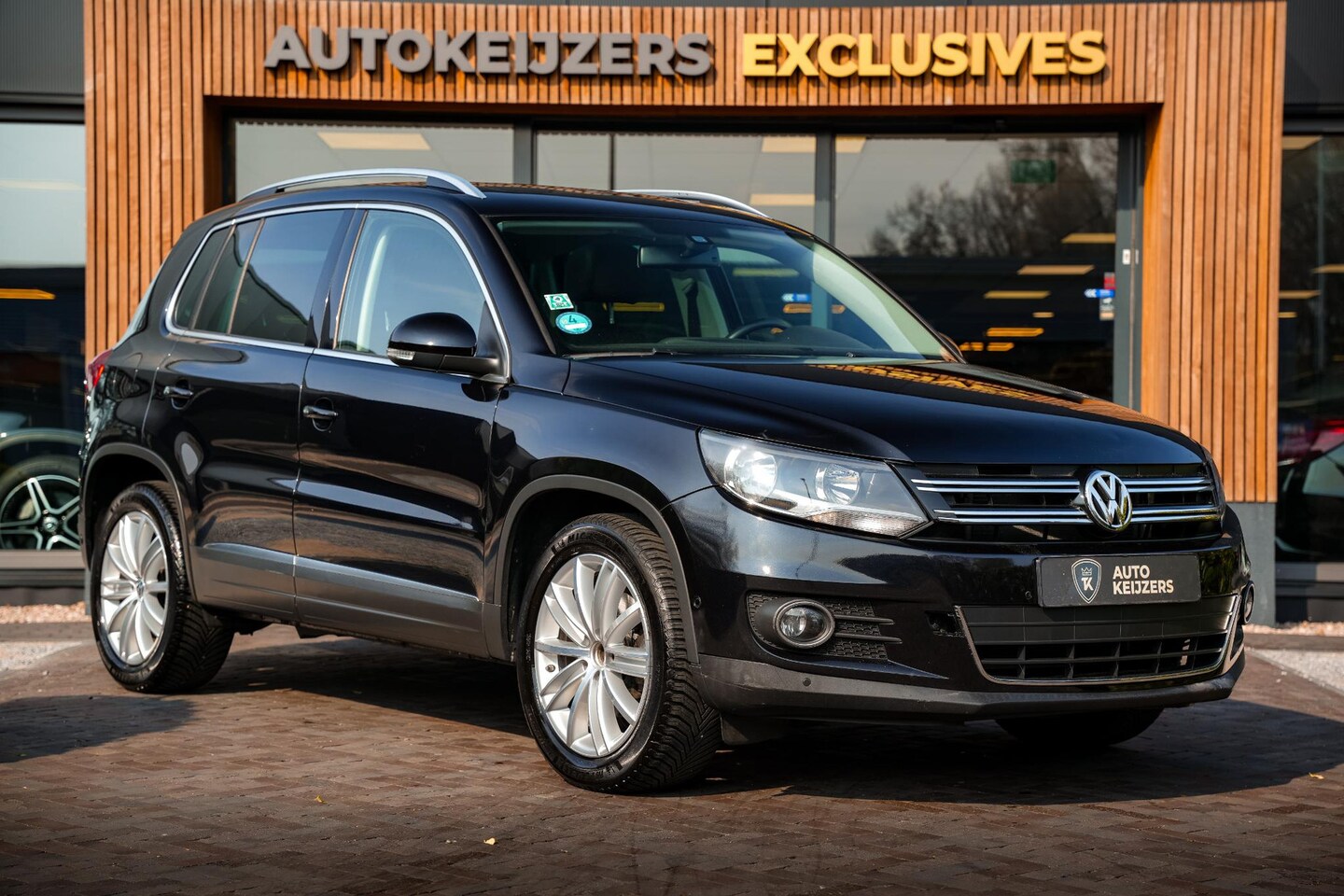 Volkswagen Tiguan - 1.4 TSI Sport&Style Panoramadak Cruise Clima PDC - AutoWereld.nl