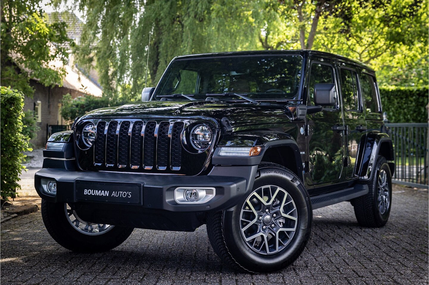 Jeep Wrangler Unlimited - 4xe 380 Sahara Sky One Softtop Cabriodak Trekhaak Adaptive Cruise - AutoWereld.nl