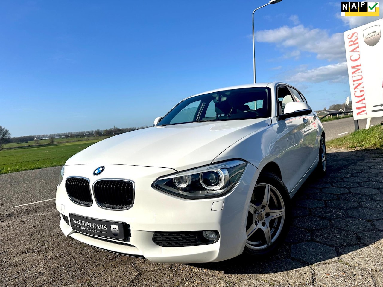 BMW 1-serie - 116i NAP 5DR AIRCO XENON NAVI SCHERM VELGEN CRUISE CONTROL - AutoWereld.nl