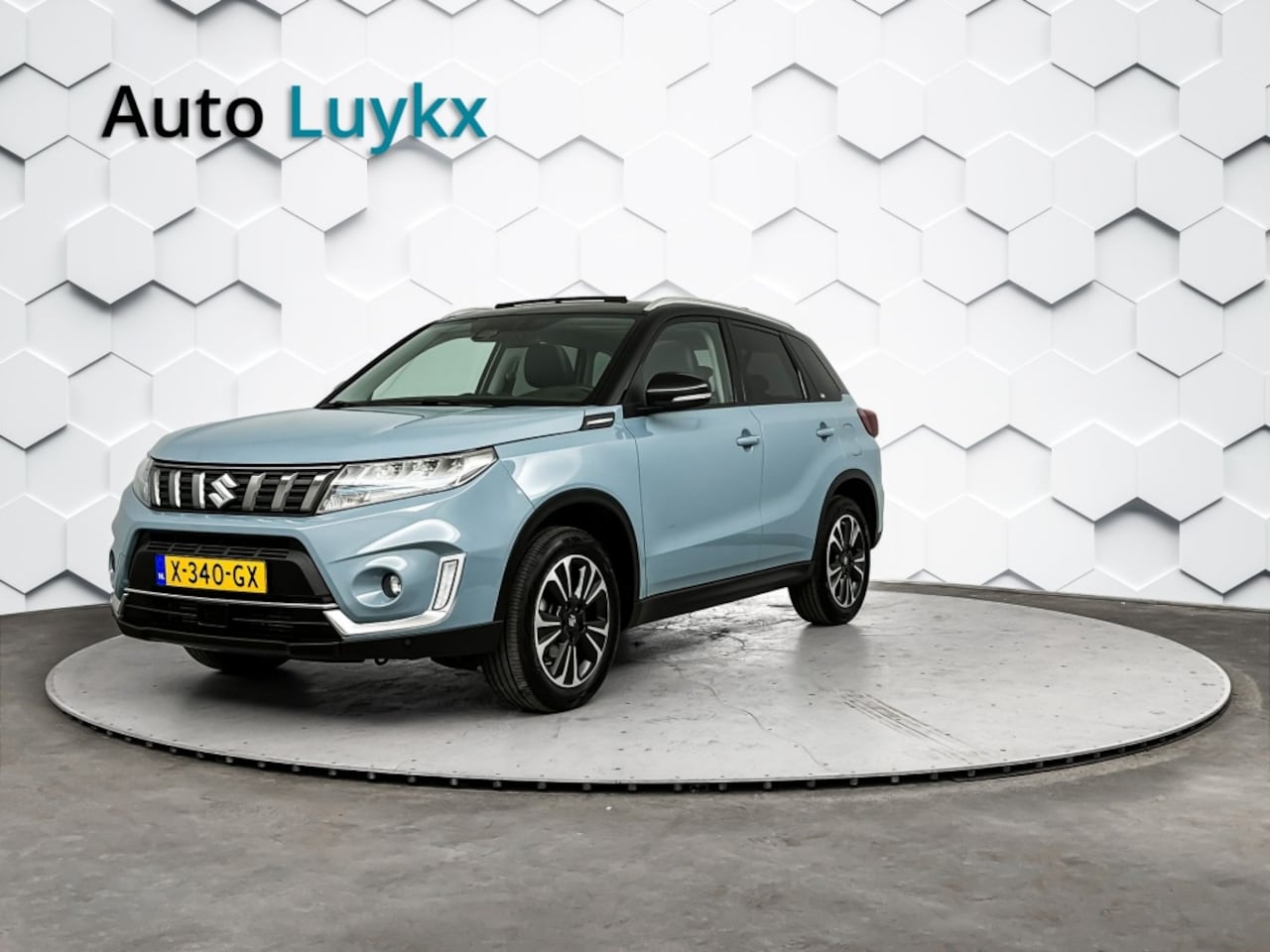 Suzuki Vitara - 1.4 Boosterjet Style Smart Hybrid | Panoramadak | Leder/Alcantara | Trekhaak - AutoWereld.nl