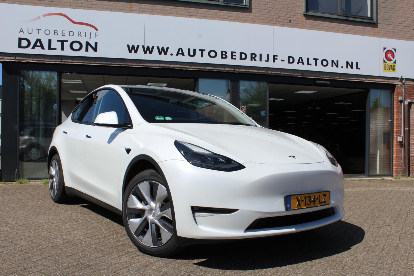 Tesla Model Y - Long Range AWD 75 kWh TREKHAAK/LEER/PANO - AutoWereld.nl