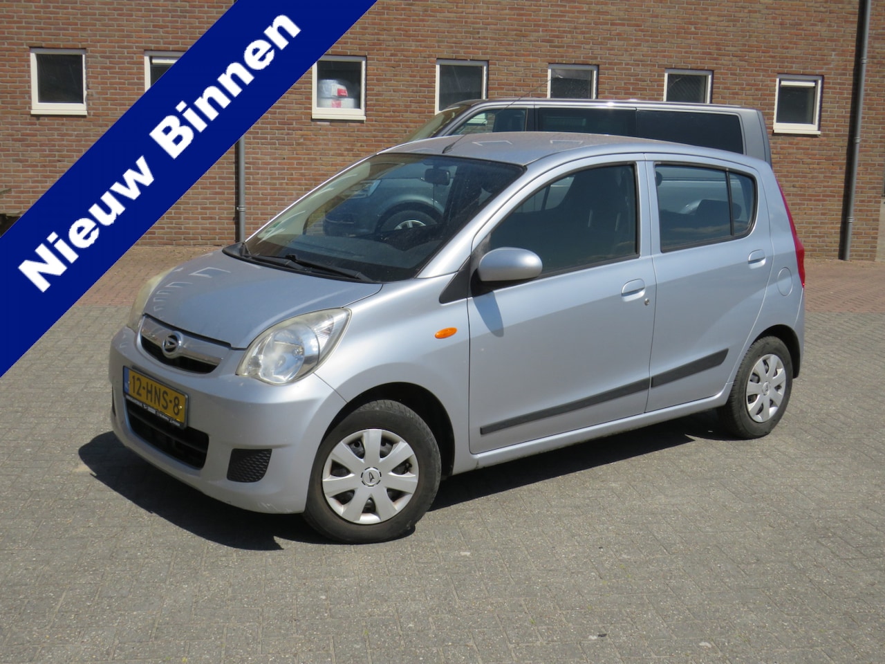 Daihatsu Cuore - 1.0 Premium Trekhaak * Airco * Cruise Control * Stuurbekrachtiging * Audio * Verschuifbare - AutoWereld.nl