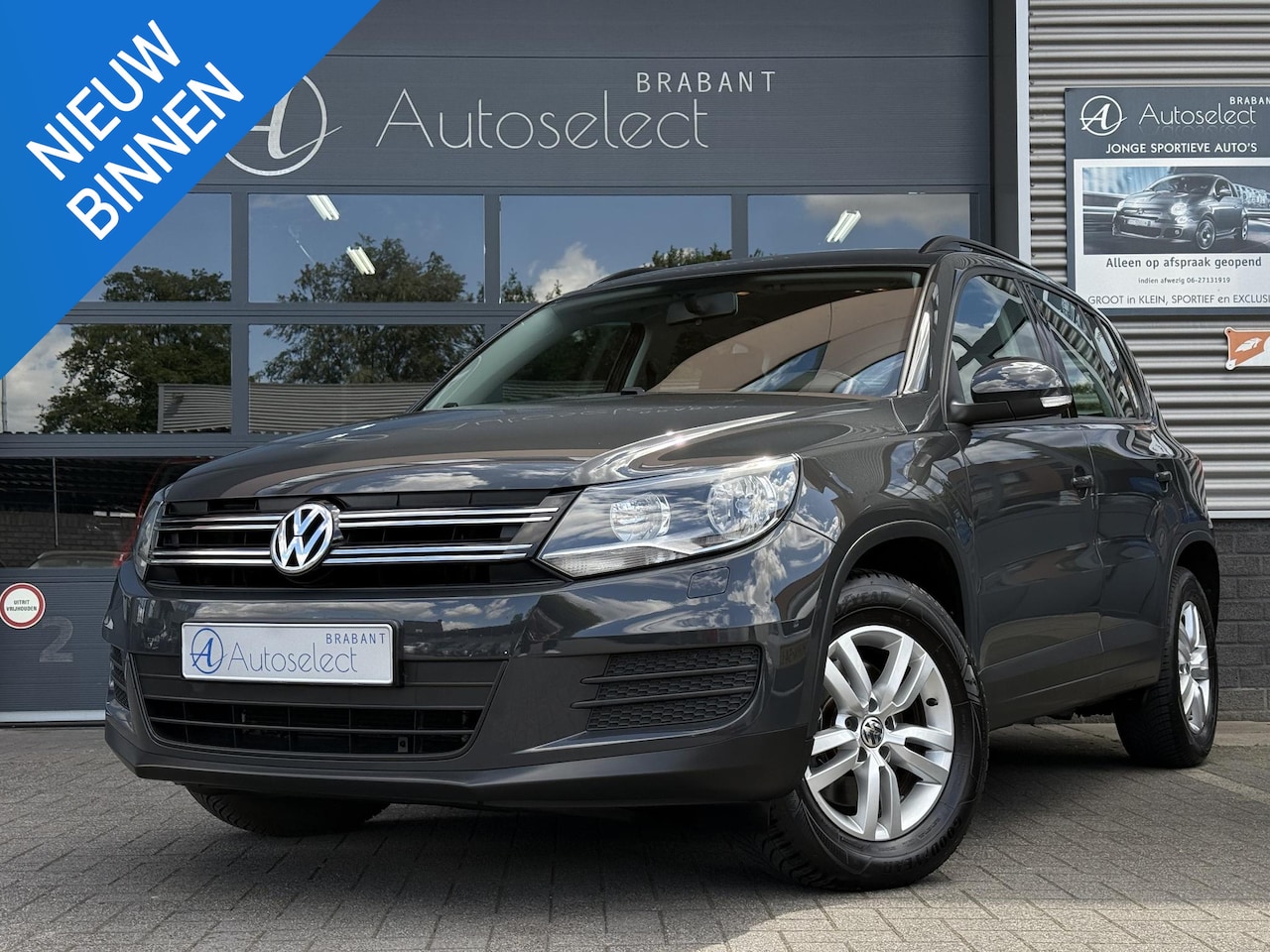 Volkswagen Tiguan - 1.4 TSI Sport&Style Airco Bluetooth LMV - AutoWereld.nl