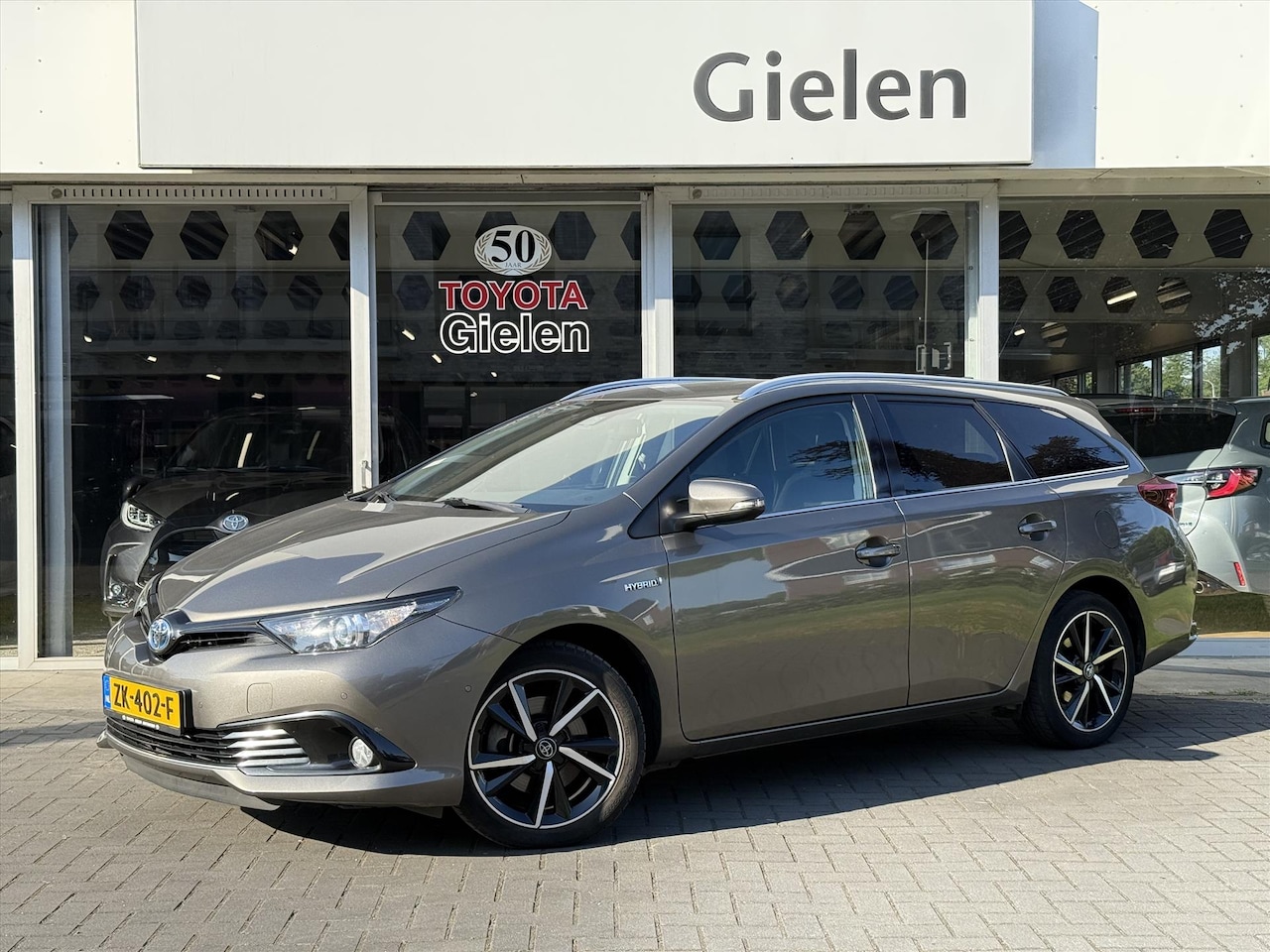 Toyota Auris Touring Sports - 1.8 Hybrid Dynamic Ultimate | Eerste eigenaar, 17 inch, Stoelverwarming, Navigatie, Keyles - AutoWereld.nl