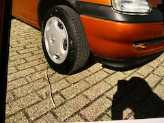 Opel Corsa - 1.2i-16V Strada