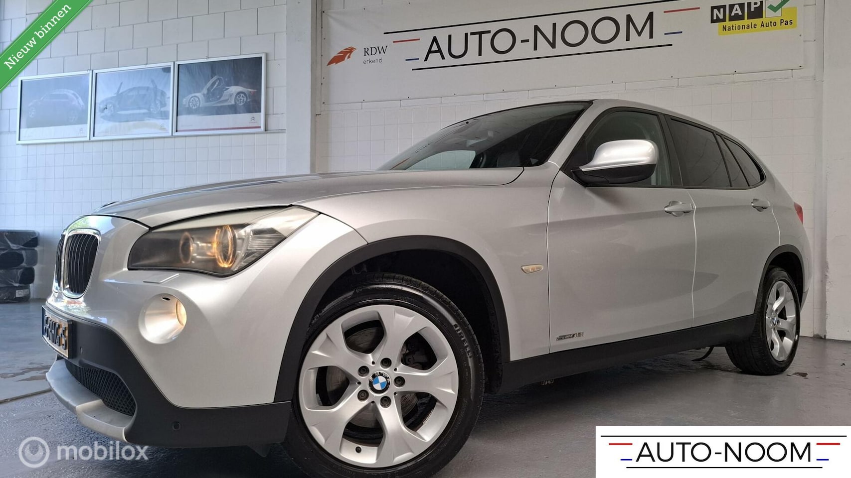 BMW X1 - sDrive18i Executive NL-AUTO/NAP/XENON/NAVI/CAMERA/PDC/TREKHAAK ✔️ - AutoWereld.nl