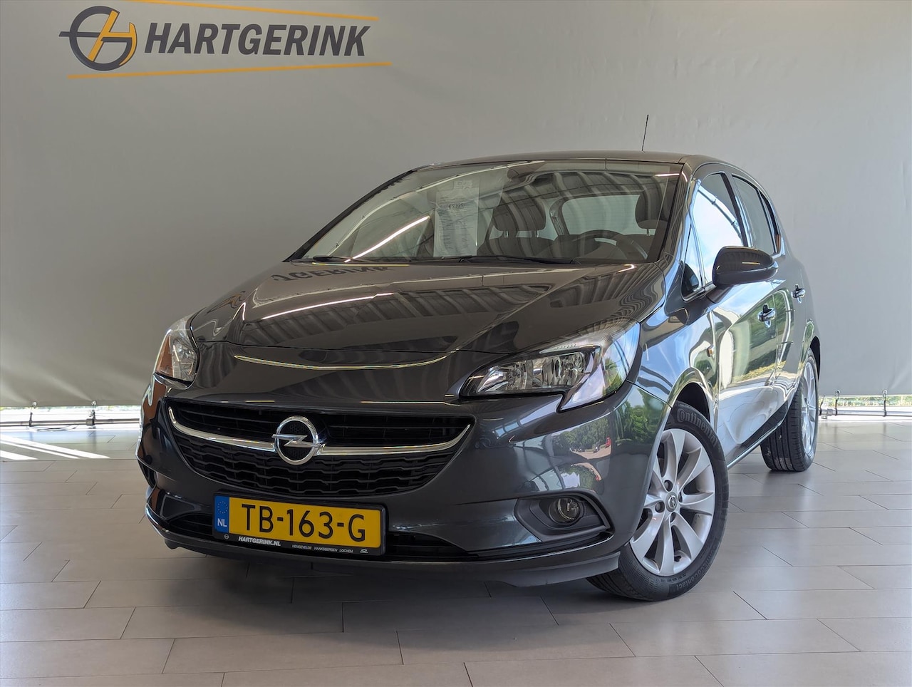 Opel Corsa - 1.4 90pk 5d Favourite *Airco/Navi* - AutoWereld.nl