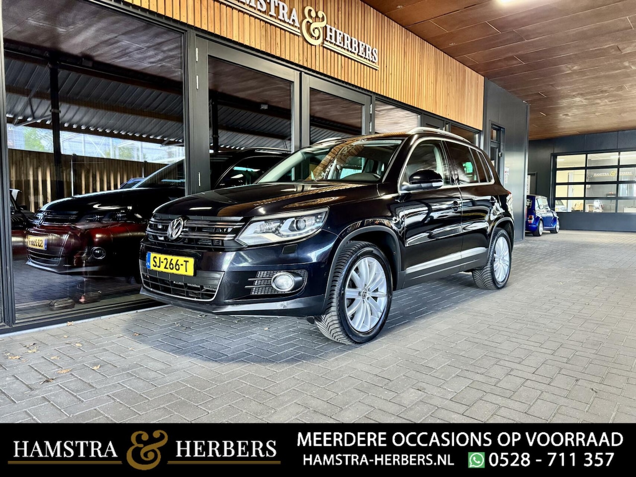 Volkswagen Tiguan - 2.0 TSI Sport&Style 4Motion zwart - AutoWereld.nl