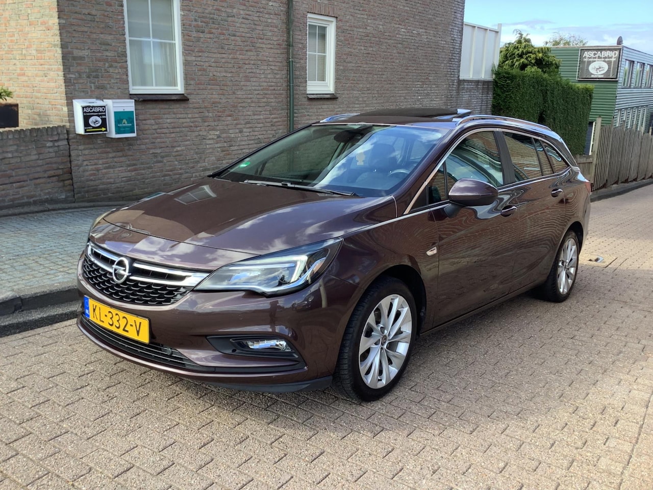 Opel Astra Sports Tourer - 1.0 Business+ vol opties schuifdak - AutoWereld.nl