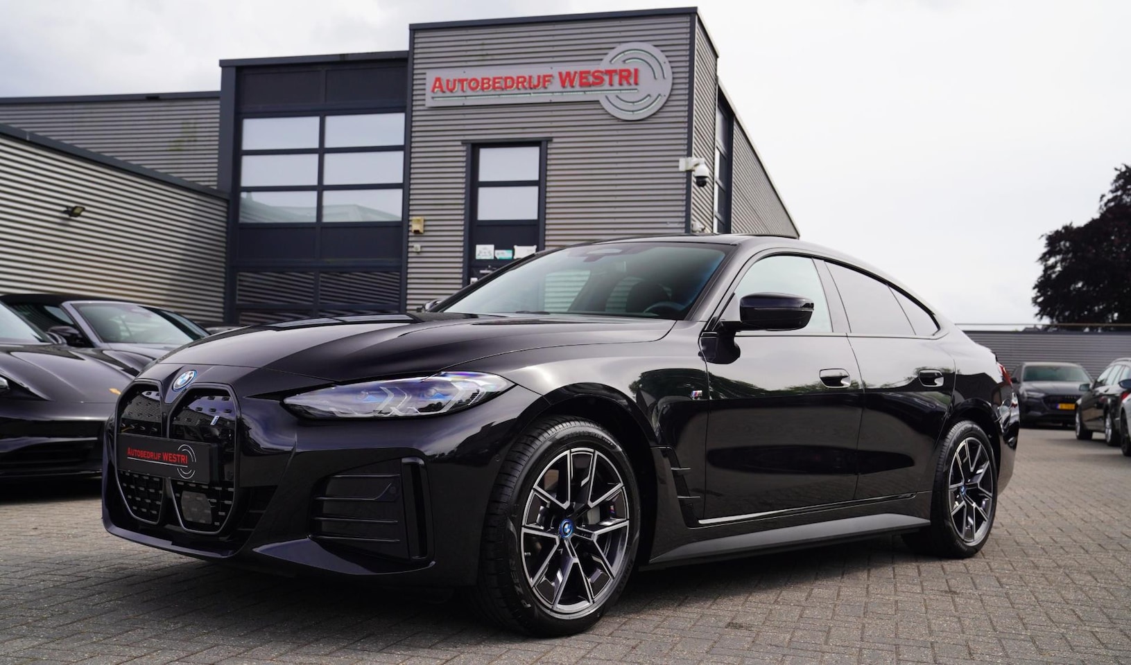 BMW i4 - EDrive40 High Executive | Schuifdak | M-pakket | Laserlight | Iconic Sound | Driving Assis - AutoWereld.nl