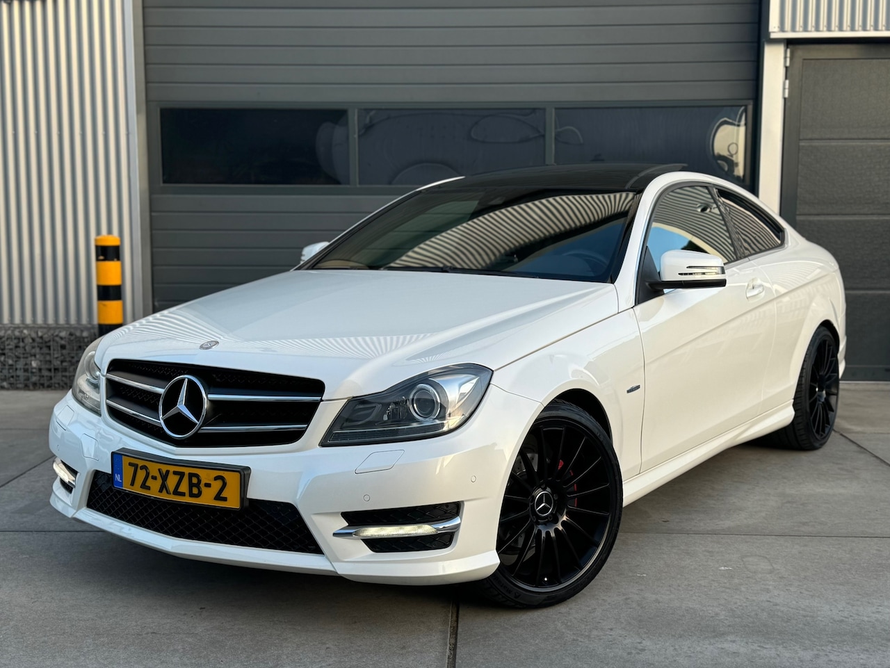 Mercedes-Benz C-klasse Coupé - 180 Ambition AMG / CLIMA / CRUISE / PANO - AutoWereld.nl