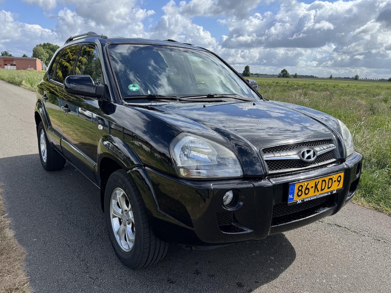 Hyundai Tucson - 2.0i Style Supreme ECC/CRUISE/PDC/GROOTSCHERM - AutoWereld.nl