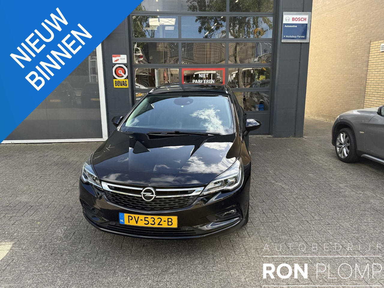 Opel Astra Sports Tourer - 1.0 Business+ / Airco/ Navigatie/ Cruise/ Apple carplay/ PDC/ Camera/ LMV - AutoWereld.nl
