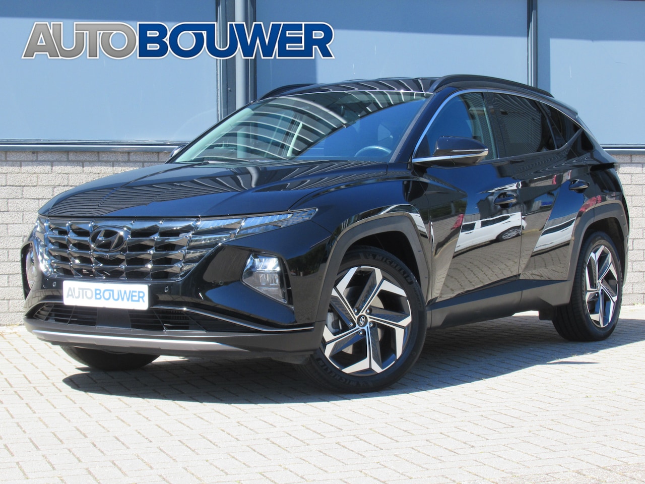 Hyundai Tucson - 1.6 T-GDI 230 PK HEV Premium 1e eigen | dealer onderh | Leder | tr.haak | 1650 KG tr. gewi - AutoWereld.nl