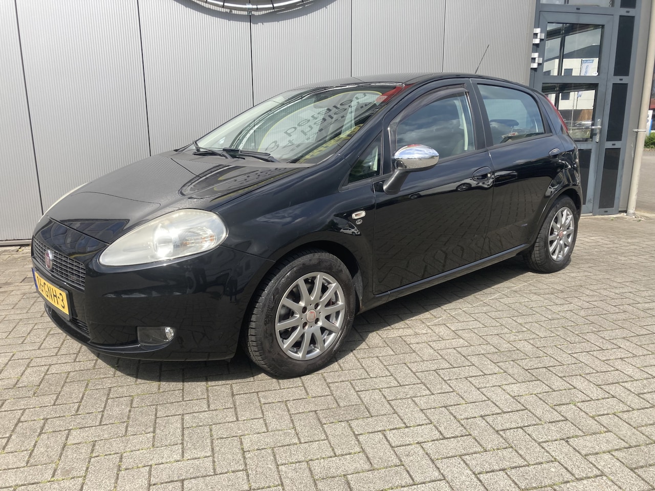 Fiat Grande Punto - 1.4 Ed. Lusso Trekhaak | Airco | Cruise Control | All season banden | Blue tooth - AutoWereld.nl